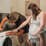 Husband helping wife with laundry